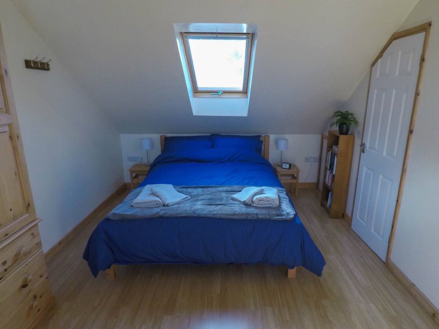 King-size bed under a skylight