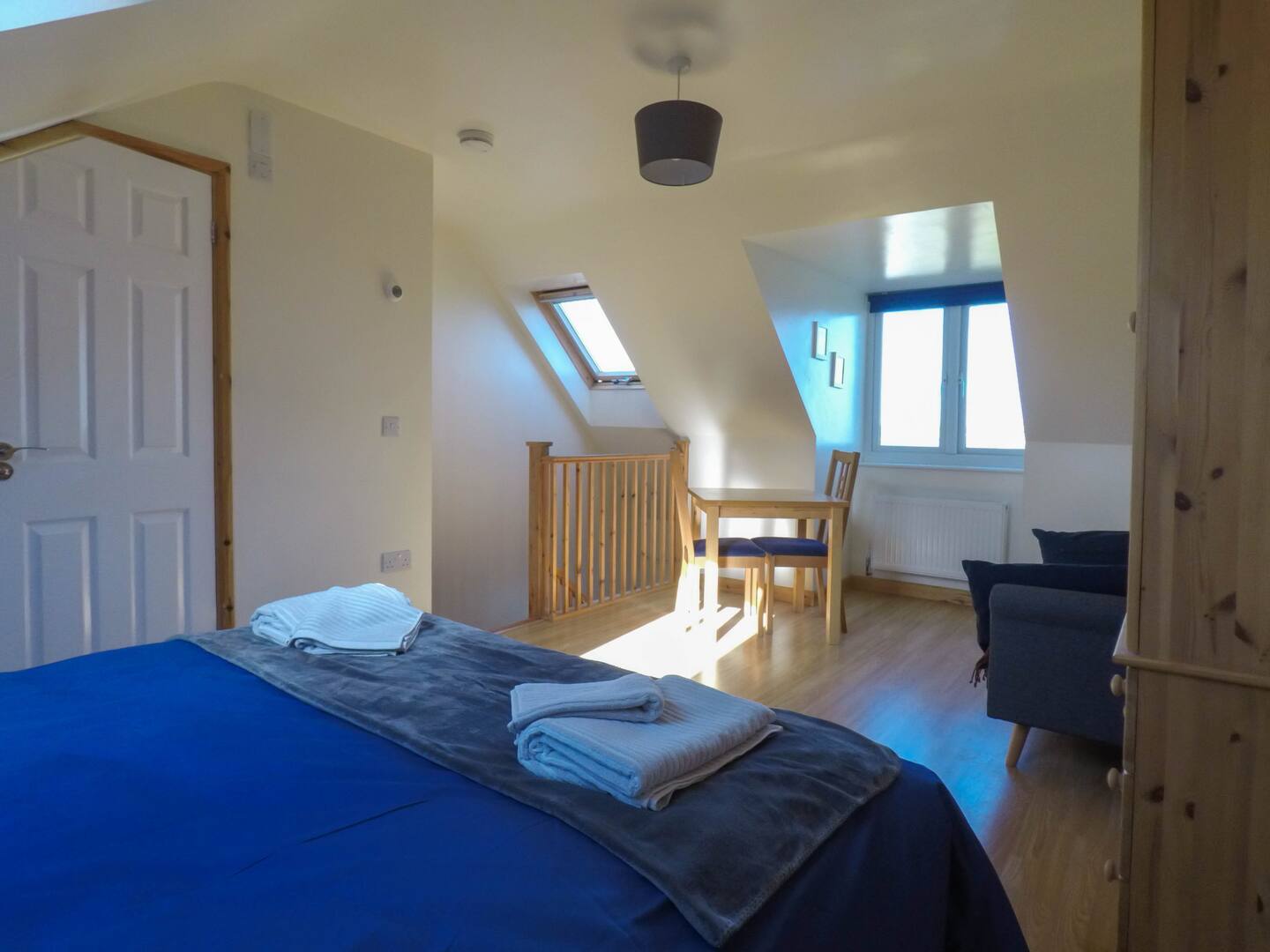 Studio with dining table by the dormer window